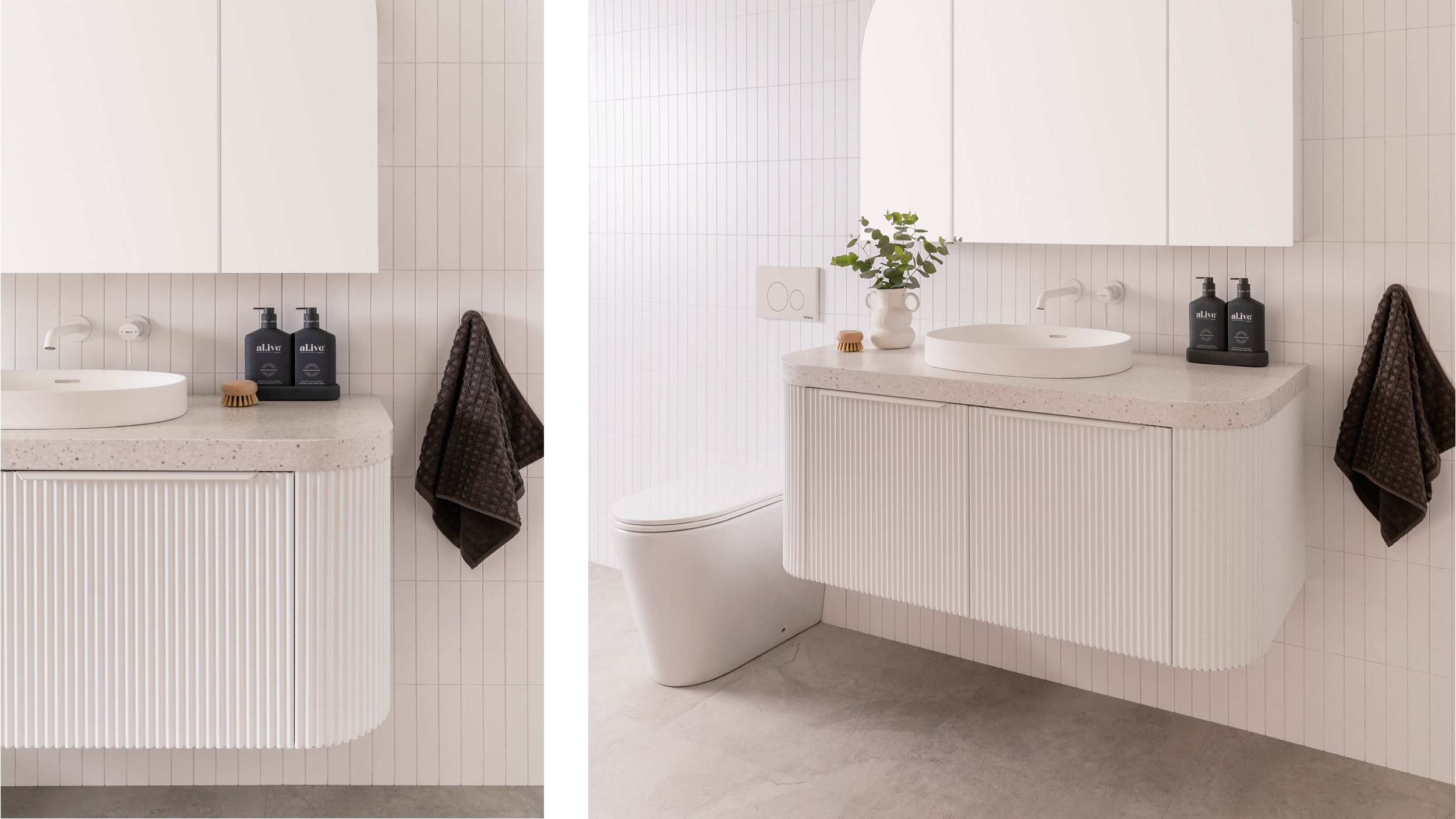 A modern bathroom featuring white walls, a white wooden vanity and a soft arched vanity mirror cupboard.