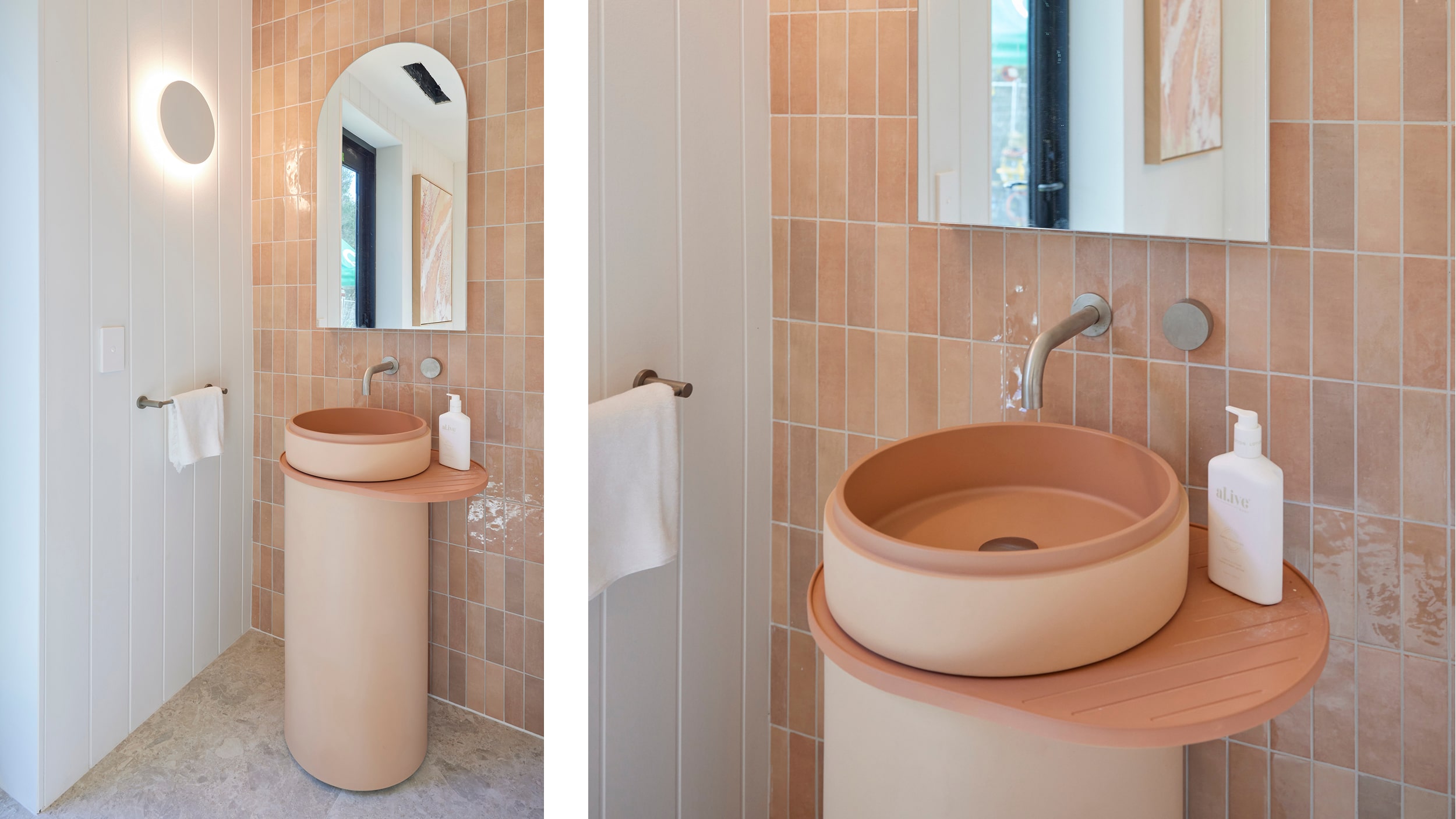 A close up of a colour drenched bathroom featuring matching peach-coloured basin, vanity and tiled feature wall.