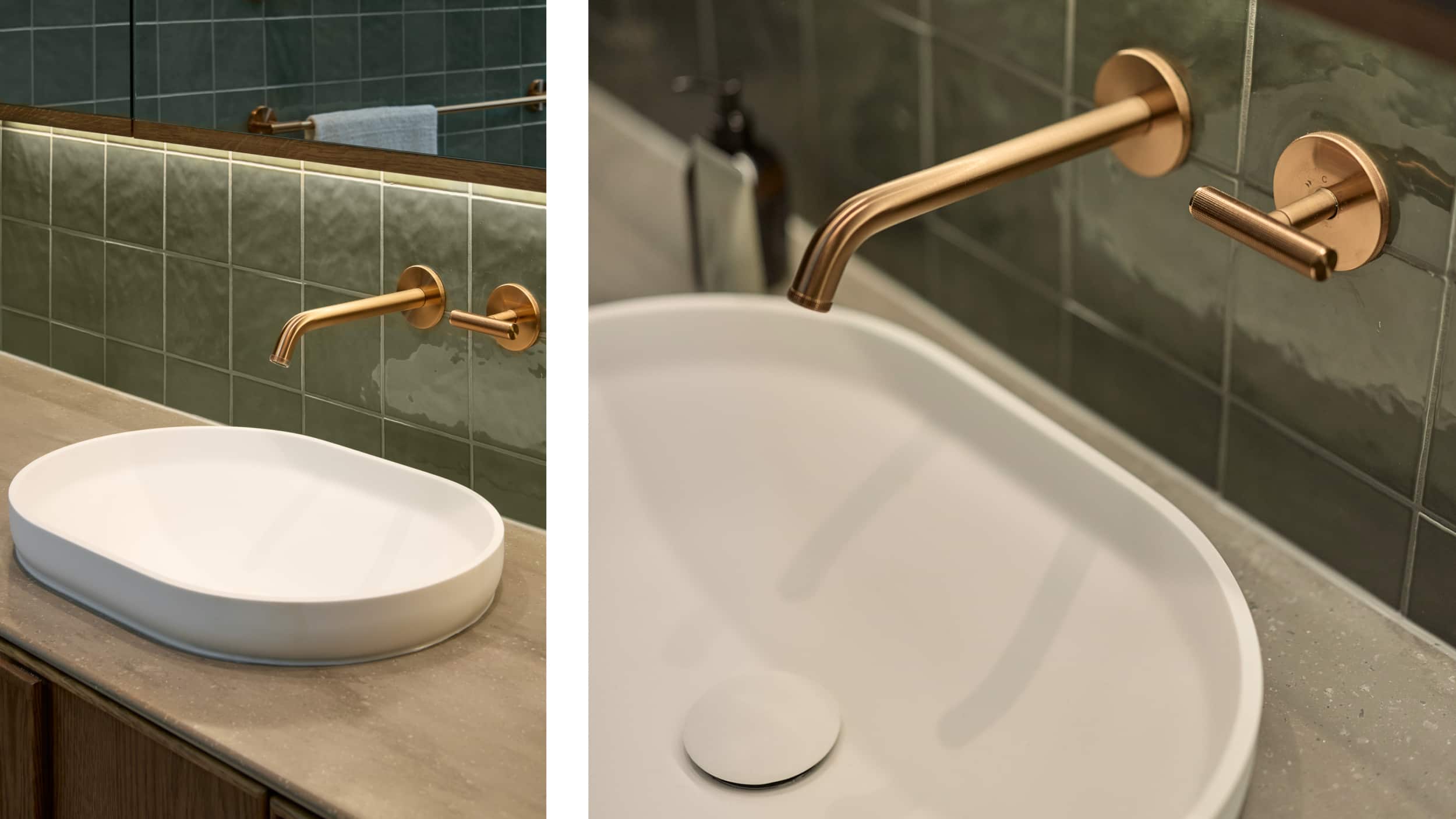 Sleek bathroom with white oval-shaped basin, green tile, and brushed bronze tapware