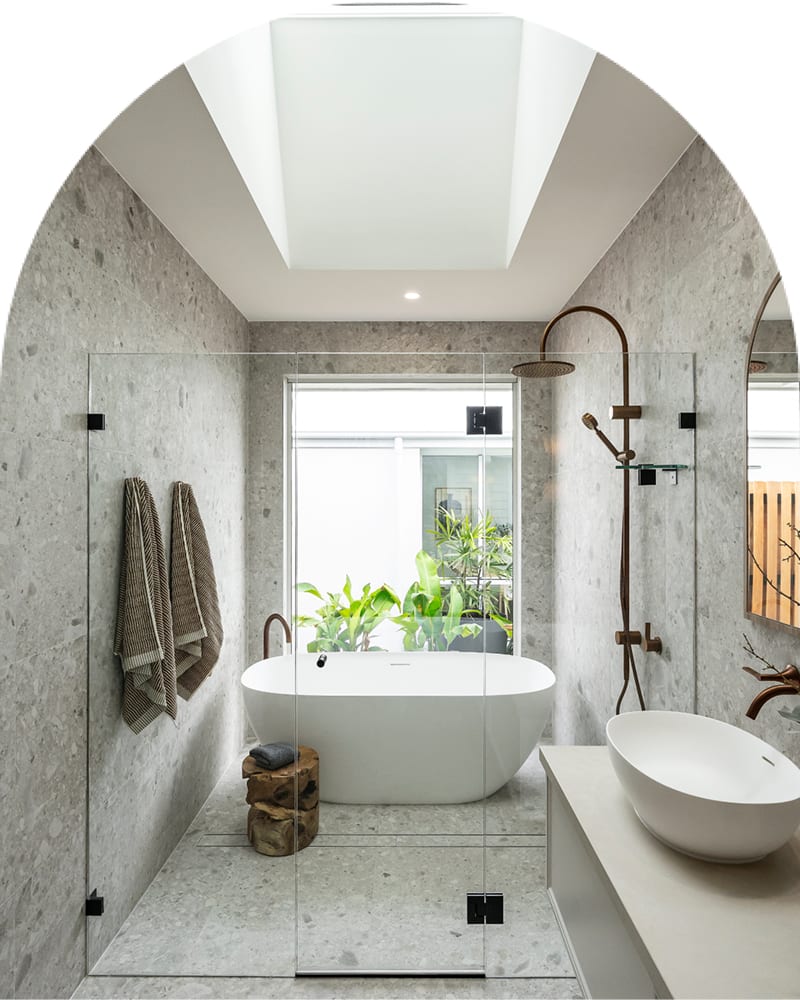 A contemporary bathroom showcasing a glass shower door next to a relaxing bathtub.