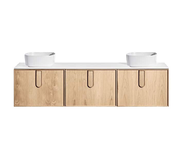 A timber vanity with two above counter basins