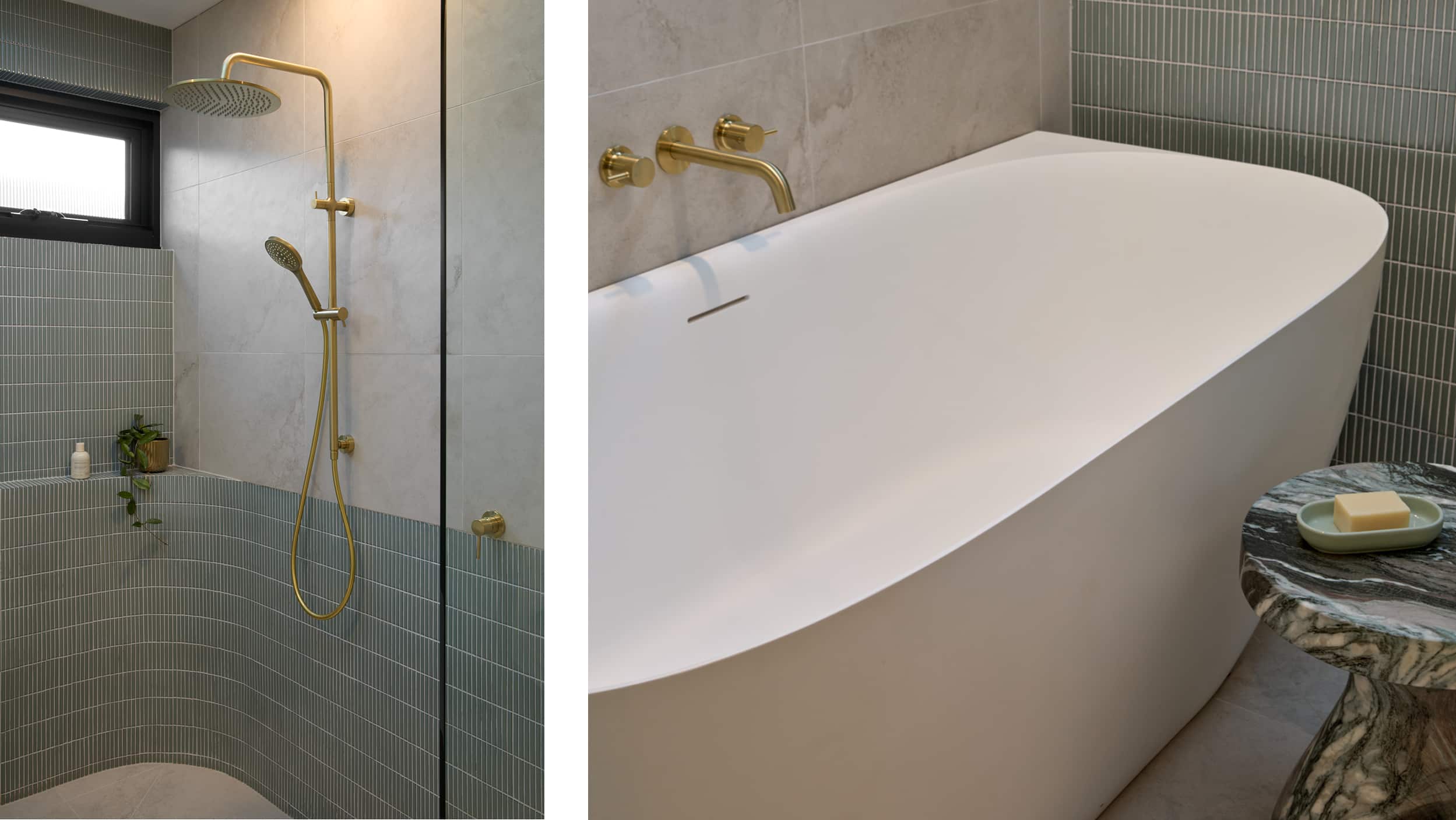 A spa-like bathroom featuring soft green tile, expansive shower with brushed brass tapware, and deep soaking bath