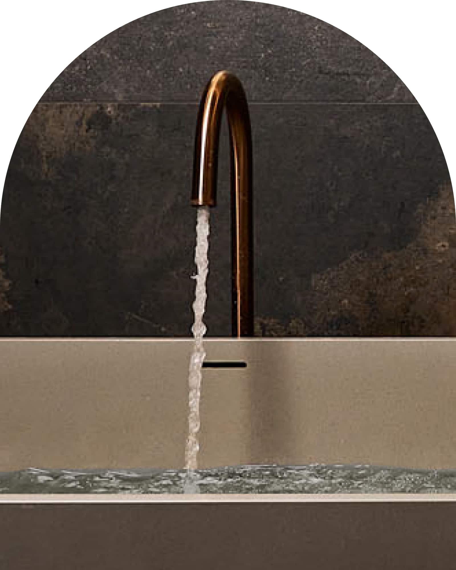 Water running out of a bronze bath outlet, into a bathtub