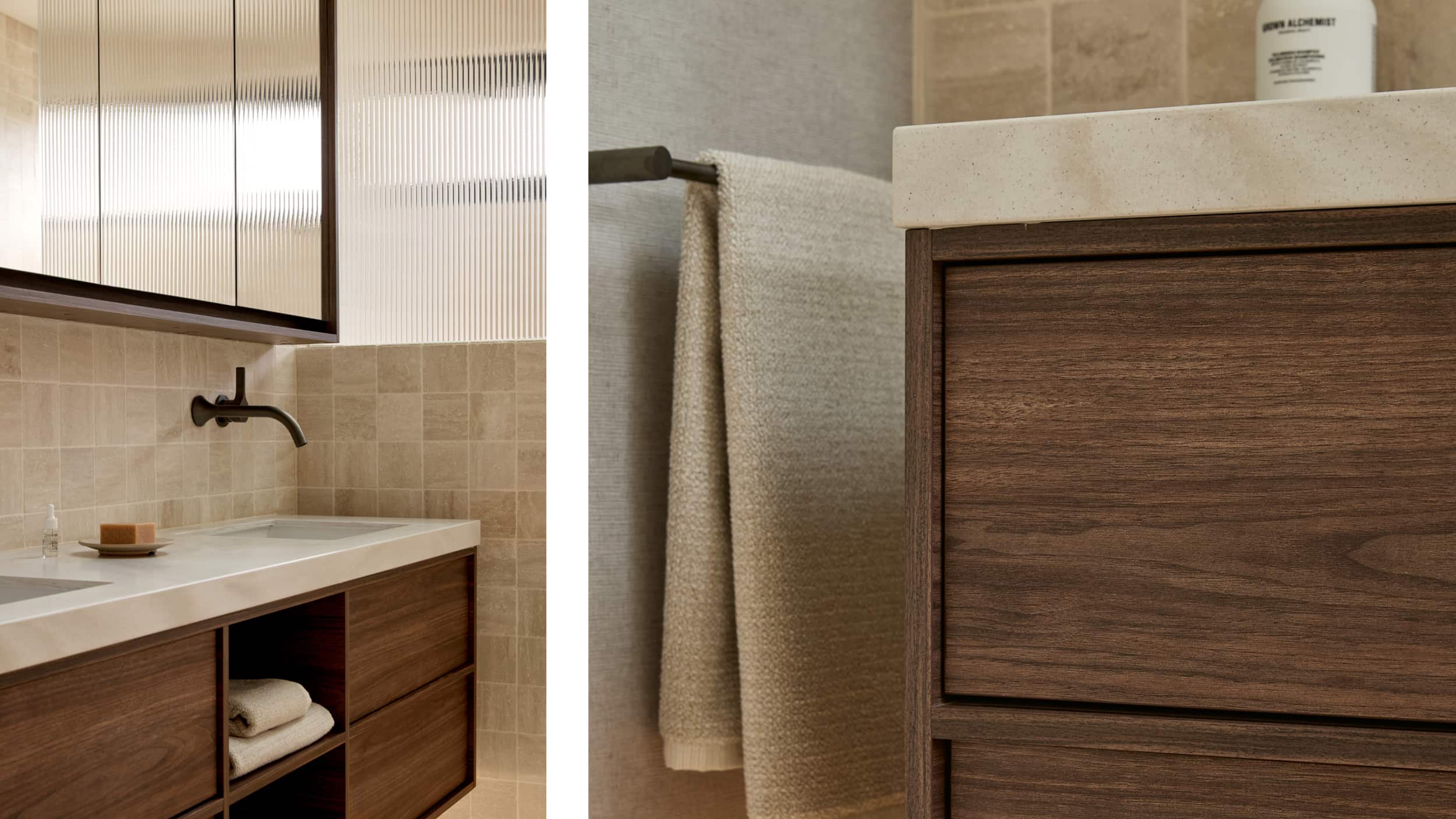 A timber vanity in a spa-like bathroom, with double basins, gunmetal tapware and mirrored shaving cabinet