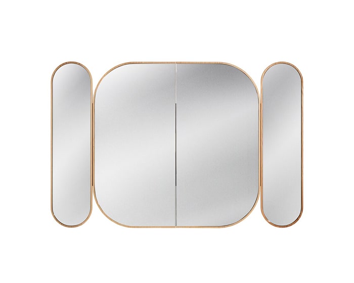 A sculptural mirror with three panels