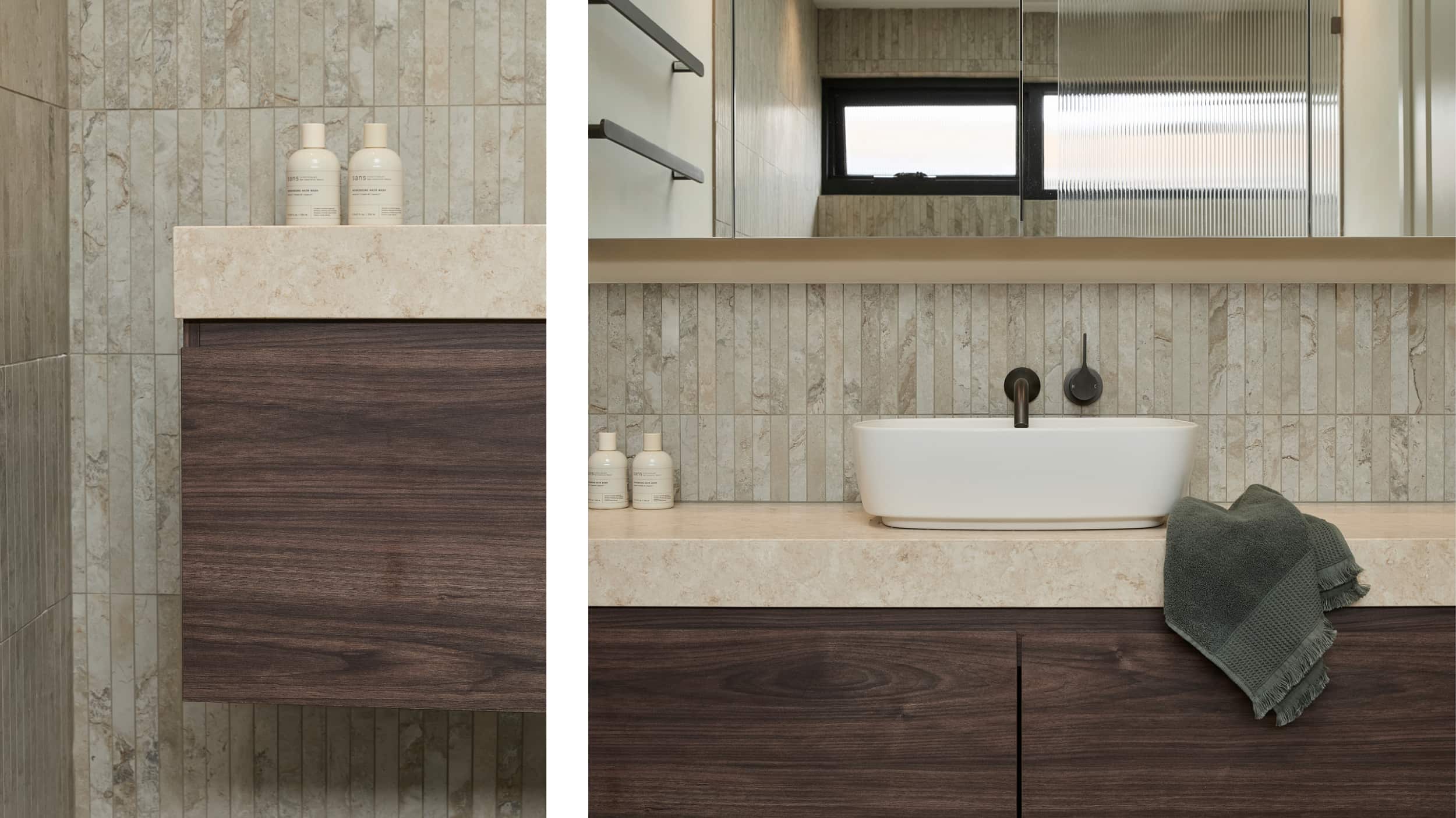 Dark timber vanity with single above counter basin, on a coffee-coloured tile wall