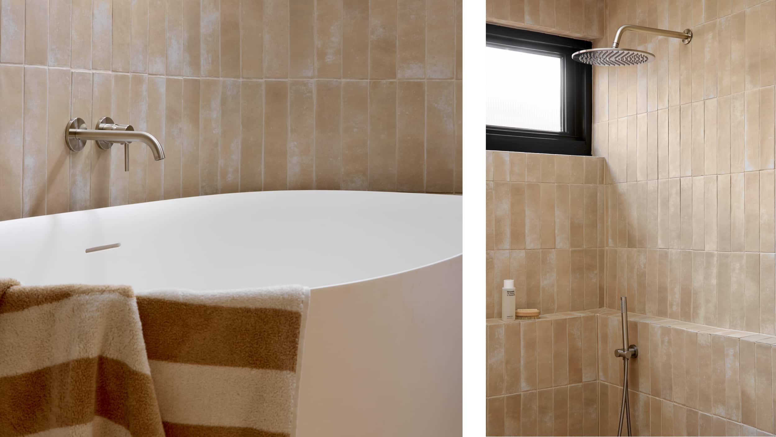 A spa-like bathroom featuring muted tile, freestanding bath with draped striped towel, next to an expansive shower with brushed nickel tapware