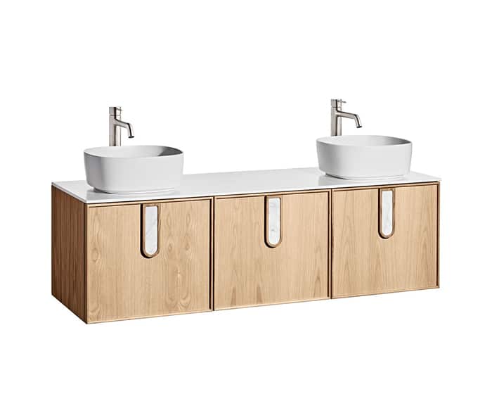 A timber vanity with 3 doors, and two white above counter basins