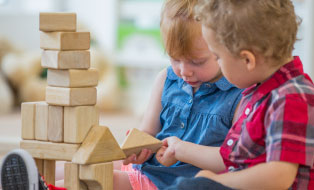Image of child playing with train 